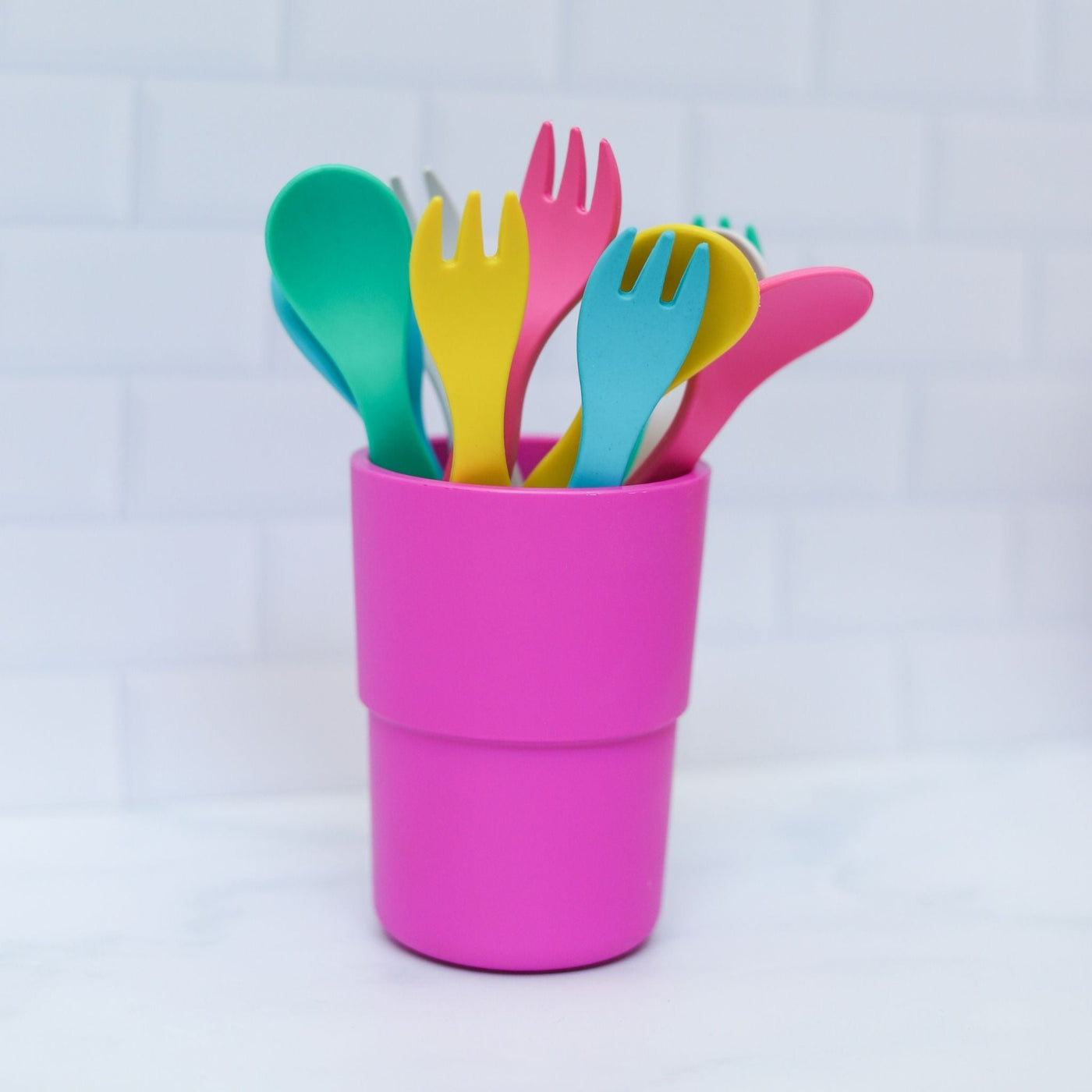 Bobo&boo cutlery forks & spoons which are colourful & eco-friendly placed in a cup