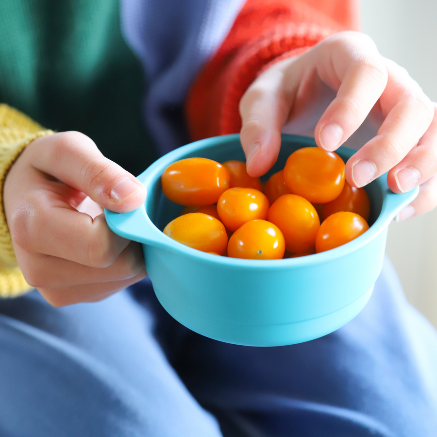 bamboo snack bowl in blue with cherry tomatoes in them 