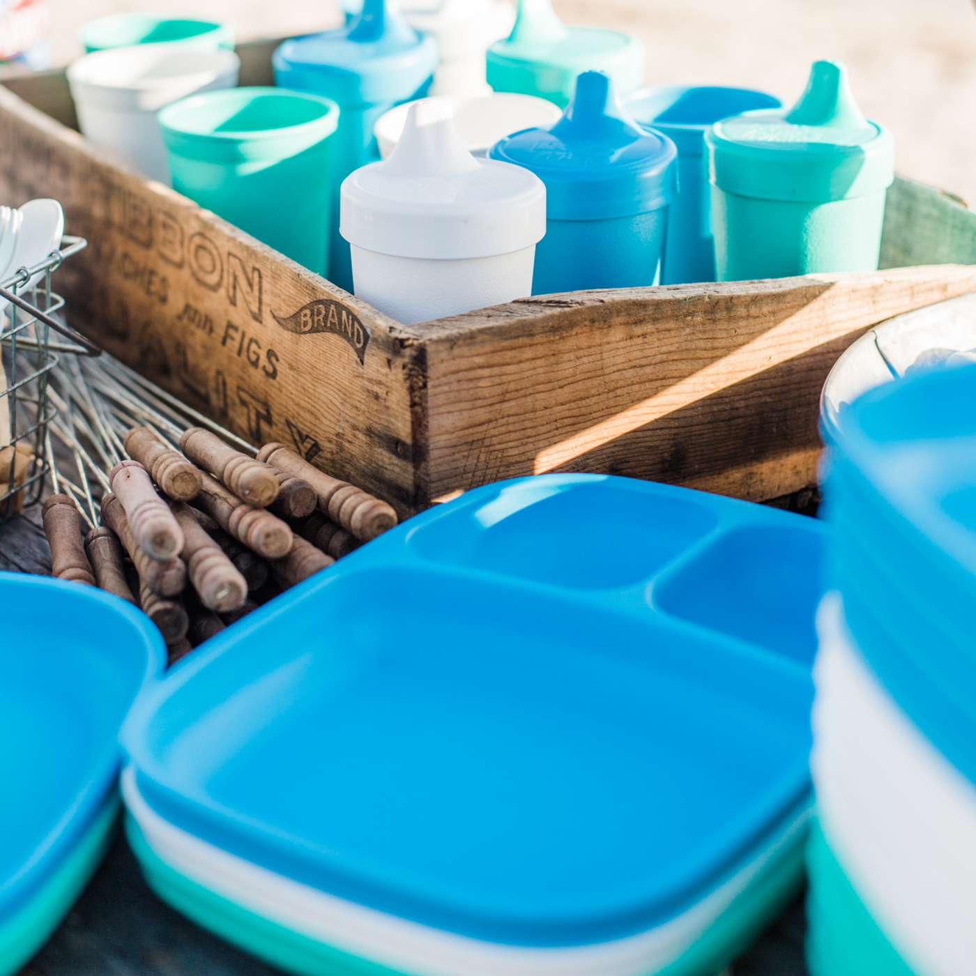 Blue and white containers with wooden crate and tools in the background, RePlay Recycled Divided Tray Plate - Sky Blue