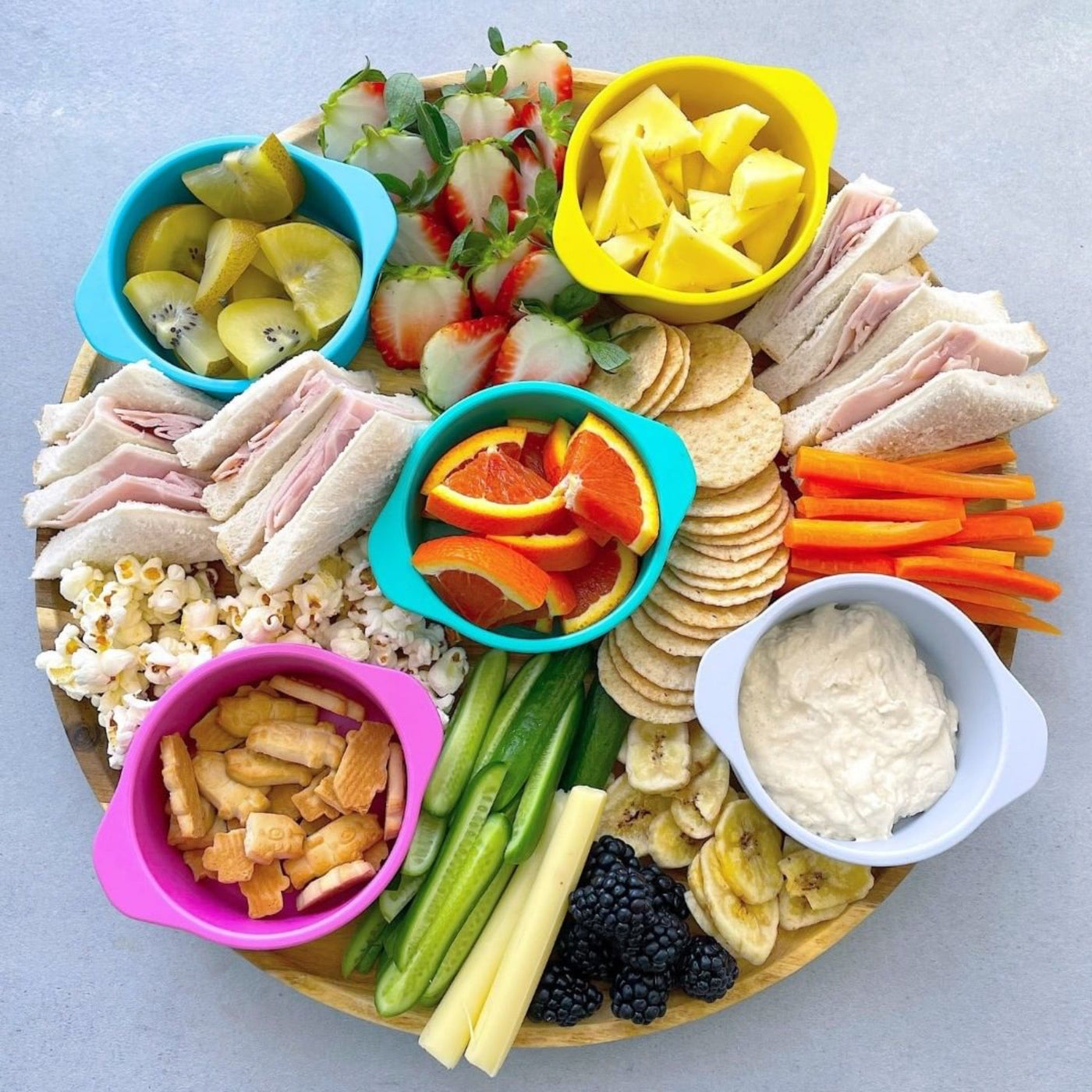 family snack platter with bamboo bright snack bowls holding snacks
